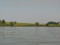 Green shore of a large pond