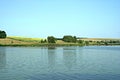 Green shore of a large pond