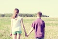 Summer sunny day park stands boy with girl holding hands enjoy nature, Meadow, fun small little family relationships Royalty Free Stock Photo