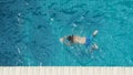 In summer sunny day swimming pool blue color clear water and people enjoying Royalty Free Stock Photo