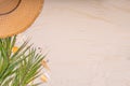 Summer sunny sand background with straw hat