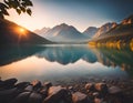 Summer sunrise on a beautiful lake with massive mountains