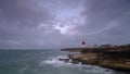 Summer sunrise with stormy clouds and slow shutter speed at Portland Bill Light, Dorset, UK Royalty Free Stock Photo