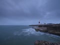 Summer sunrise with stormy clouds and slow shutter speed at Portland Bill Light, Dorset, UK Royalty Free Stock Photo