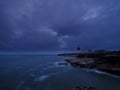 Summer sunrise with stormy clouds and slow shutter speed at Portland Bill Light, Dorset, UK Royalty Free Stock Photo