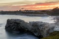 Summer sunset above Natural Bridges State Beach. Royalty Free Stock Photo