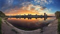 Summer sunset in the city. Reflection on the river. Royalty Free Stock Photo