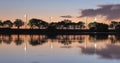 Summer sunset on the lake with clouds reflection Royalty Free Stock Photo