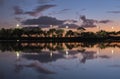 Summer sunset on the lake with clouds reflection Royalty Free Stock Photo