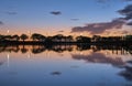 Summer sunset on the lake with clouds reflection Royalty Free Stock Photo