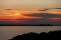 Summer sunset on Lake Trasimeno in Umbria with Castiglione del Lago on background Royalty Free Stock Photo