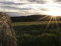 Summer sunset from the meadow with hay bales Royalty Free Stock Photo