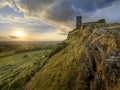 Summer sunset over Brentor, with the church of St Michael de Rupe - St Michael of the Rock, on the edge of the Dartmoor National