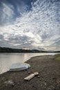 Summer sunset over lake in landscape with leisure boats and equi Royalty Free Stock Photo