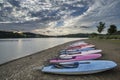 Summer sunset over lake in landscape with leisure boats and equi Royalty Free Stock Photo