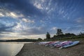 Summer sunset over lake in landscape with leisure boats and equi Royalty Free Stock Photo