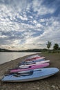 Summer sunset over lake in landscape with leisure boats and equi Royalty Free Stock Photo