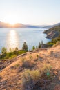 Summer sunset over Okanagan Lake view from Naramata Bench with mountains in distance