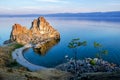 Summer sunset over Rock of Shamanka Burhan on Olkhon Island in Lake Baikal, Russia