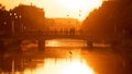 Summer sunset with people silhouette in Bucharest city , bridge over Dambovita River Royalty Free Stock Photo