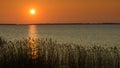 Summer sunset at Turawskie Lake, reflection of the setting sun in the water