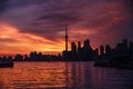 Summer sunset view from Toronto Islands across the Inner Harbour of the Lake Ontario on Downtown Toronto skyline with Royalty Free Stock Photo