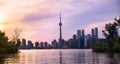 Summer sunset view from Toronto Islands across the Inner Harbour of the Lake Ontario on Downtown Toronto skyline with Royalty Free Stock Photo