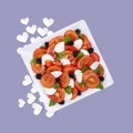 Summer Sunshine salad of Tomato, basil and Mozzarella on a coloured background with hearts