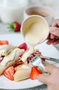 Summer sweet breakfast with french pancakes with strawberries and vanilla sauce. Royalty Free Stock Photo