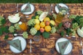 Summer table set. Outdoor dining. Table decorated fresh flowers and fruits. Royalty Free Stock Photo