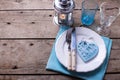 Summer table setting. Decorative heart, knife and fork on white
