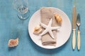 Summer table setting in marine style, decorated with shells Royalty Free Stock Photo