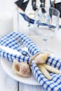 Summer table setting in marine style, decorated with shells and Royalty Free Stock Photo