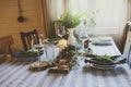 Summer table setting in natural organic style with handmade details in green and brown tones