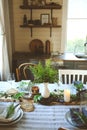 Summer table setting in natural organic style with handmade details in green and brown tones