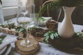 Summer table setting in natural organic style with handmade details in green and brown tones