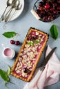 Summer tart with cherry custard on a gray deton background. Selective focus.Top view. Copy space Royalty Free Stock Photo