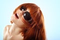 Summer teen girl redheaded in sunglasses over blue Royalty Free Stock Photo