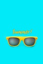 Summer! text and yellow sunglasses in intense cyan blue background. Minimal image concept for ready for summer Royalty Free Stock Photo