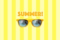 Summer text and yellow sunglasses with palm tree reflections isolated in large pastel yellow striped background. Royalty Free Stock Photo