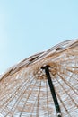 Summer texture and background. Wicker lattice roof of beach umbrella.