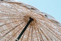 Summer texture and background. Wicker lattice roof of beach umbrella.