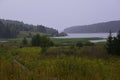 Thunderstorm downpour over the mouth of the Yurman River. Summer bad weather in the foothills of the Western Urals.