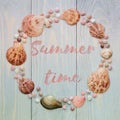 Summer time background with sea shells and lettering on blue wooden planks.