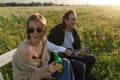 Summer time. Beautiful young couple enjoying time in field around grass. Lifestyle, love, dating, vacation concept Royalty Free Stock Photo