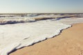 Summer time blue sea waves yellow sun and sand Royalty Free Stock Photo