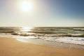 Summer time blue sea waves yellow sun and sand Royalty Free Stock Photo