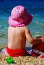 Summer time - child play on the pebbles beach Royalty Free Stock Photo