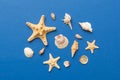 Summer time concept Flat lay composition with beautiful starfish and sea shells on colored table, top view with copy Royalty Free Stock Photo