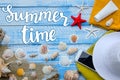 Summer time. Flat lay lettering. Sea beach accessories - shells, mussels, sea stars on a blue wooden background